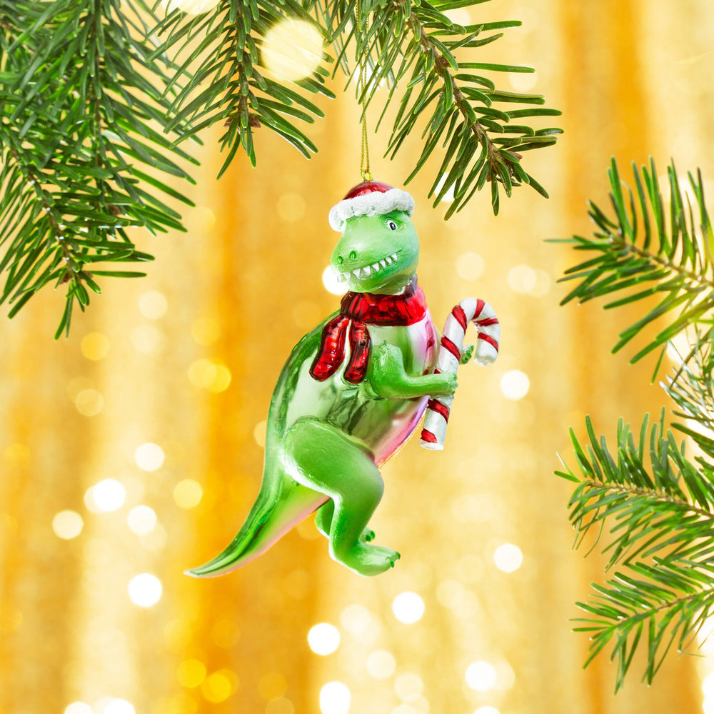 Boule de Noël T-Rex au sucre d'orge suspendue au sapin